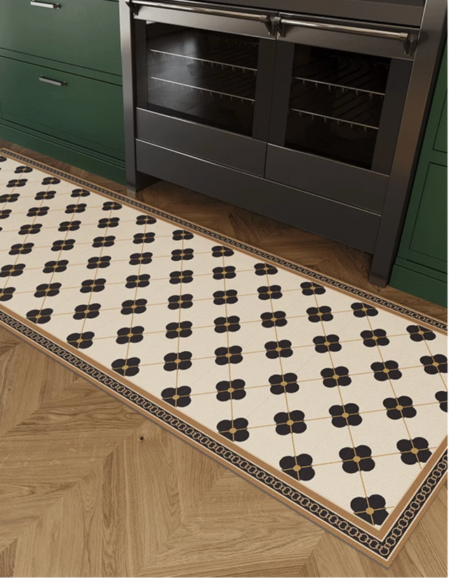 The Parisienne Kitchen Mat adds elegant French-inspired style to your kitchen. It's anti-slip, cushioned, and easy to maintain, perfect for your busy kitchen space! 