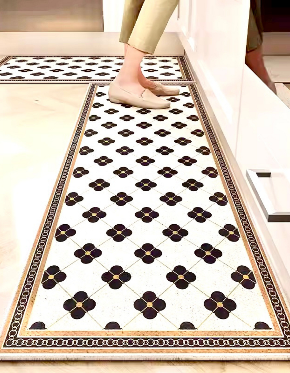 The Parisienne Kitchen Mat adds elegant French-inspired style to your kitchen. It's anti-slip, cushioned, and easy to maintain, perfect for your busy kitchen space! 