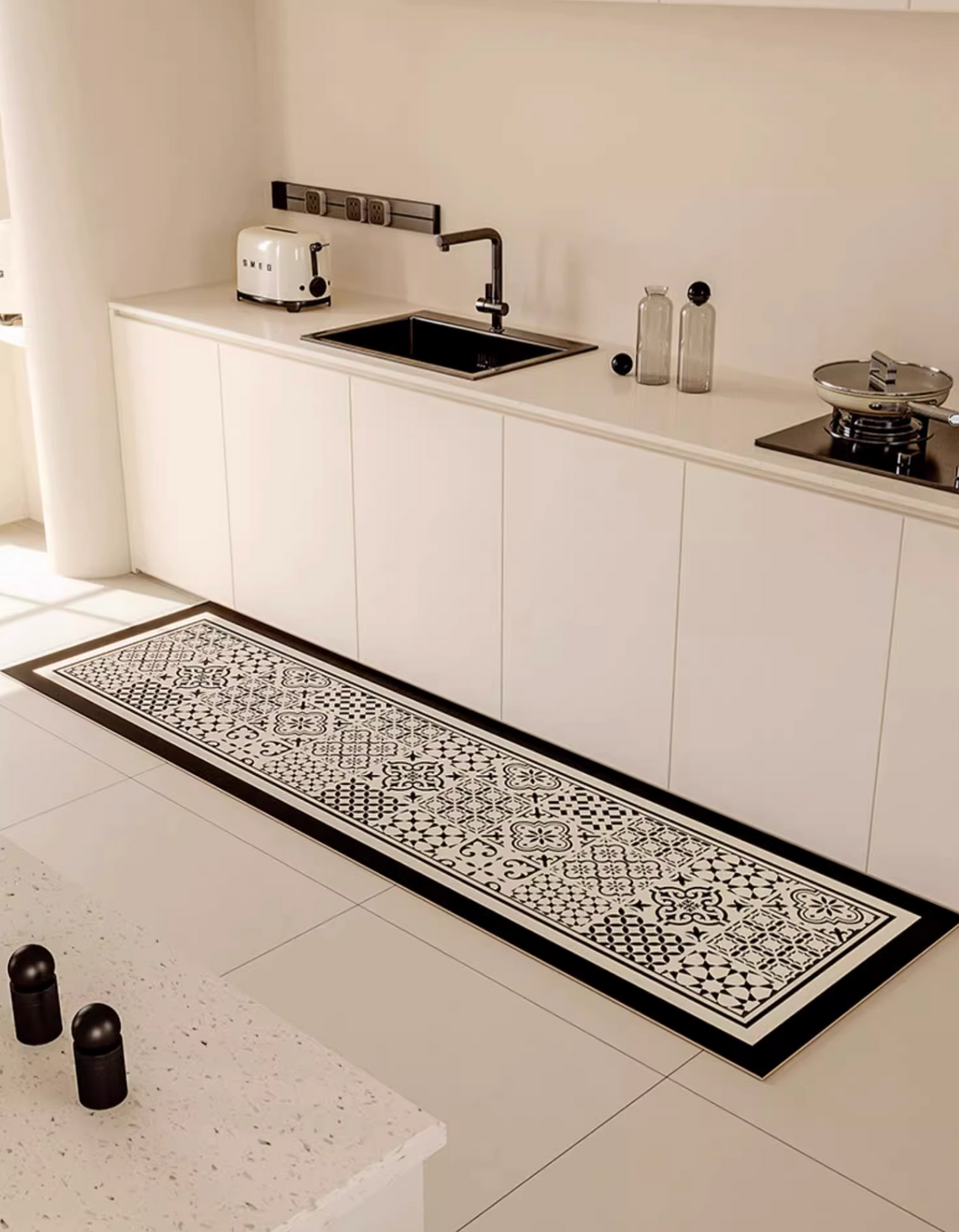 The Classic Patchwork Kitchen Mat features a geometric mosaic tile pattern that complements your home decor. It also prevents accidental slips and spills in the kitchen. 